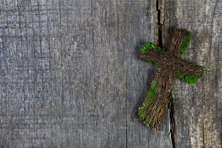 Wooden cross on a background for a condolence card.の写真素材