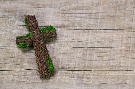 Condolence card: wooden handmade cross on a background.の写真素材