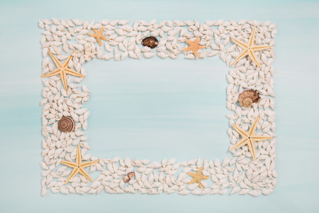 Tropical frame of starfish and shells for maritime decoration in summer.の写真素材