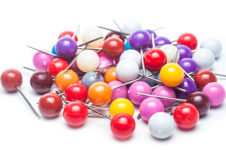 Colourful Thumbtacks on white 
