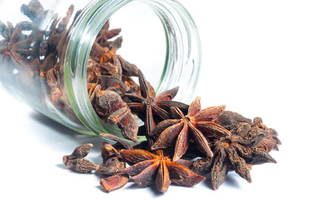 Star Anise come out from a jar on white background; isolated の写真素材