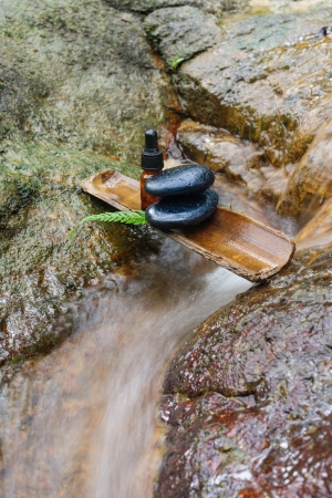 Essence oil and zen stone in spa conceptの写真素材