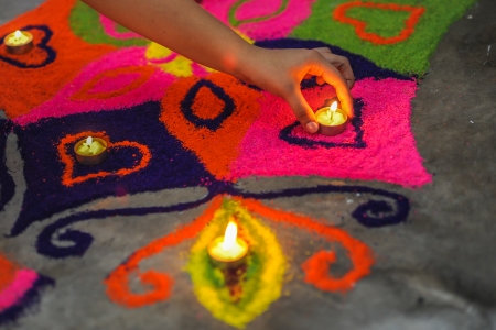 Rangoli, also known as kolam or muggu is a folk art from India  It is usually found during Deepavali and other Indian festivals  Typically consisting of bright colors, rangoli is a decorative design made in living rooms and courtyard floors during Hindu fの写真素材