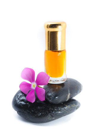 Generic Perfume and Purple Flower on stone, white backgroundの写真素材