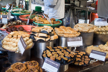 Assortment of Middle Eastern Dessert - borma, namoura, baklawa - on display at Borough Marketのeditorial素材