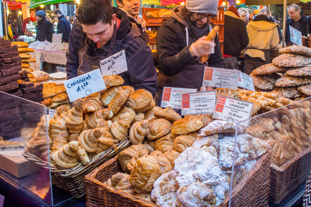 London, UK, 1 February 2014 - Stall selling assortment of pastries at Borough Market.のeditorial素材