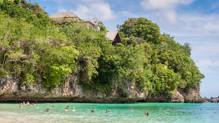Tourist swimming at a private beach in Baliのeditorial素材