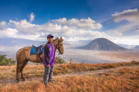 A boy and his horse at Bromo Tengger Semeru National Parkのeditorial素材
