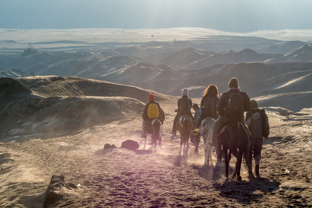 Tourists Riding Horses up the desert at Bromo Tengger Semeru National Parkのeditorial素材