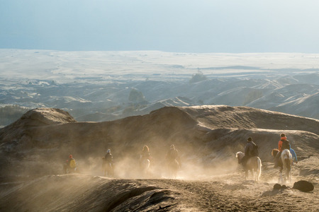 Tourists Riding Horses up the desert at Bromo Tengger Semeru National Parkのeditorial素材