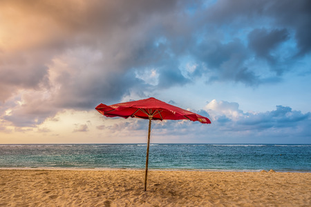 Red Umbrella on a beachの写真素材