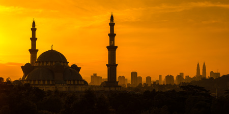 Mosque and  Towers Silhouettes . Golden Sunriseの写真素材