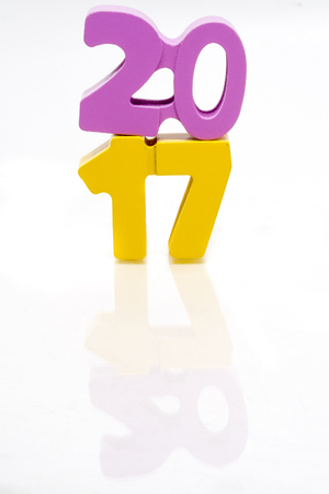 Happy New Year 2017. Block of numbers on white background, seamless with reflection