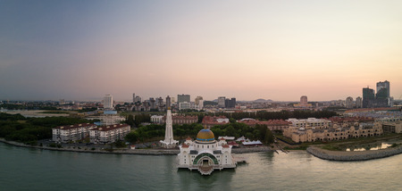 Aerial Panorama of The Melaka Straits Mosque, located on the man-made Malacca Island near Melaka City, Melaka, Malaysia,  at Sunriseの写真素材