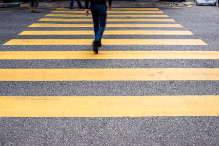 Motion Blur - People crossing the road. Blurry effect to illustrate movement