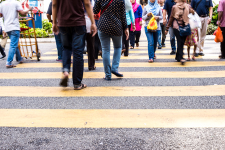 Motion Blur - People crossing the road. Blurry effect to illustrate movementの写真素材