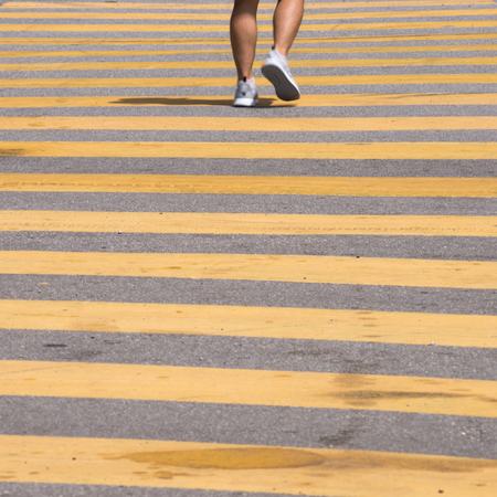 Motion Blur - People crossing the road. Blurry effect to illustrate movement