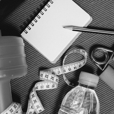 Lay Flat - Dumbbell, Measuring Tape, Hand Grip, Mineral Water, Fresh Apple, Pencil & Blank Notebook...