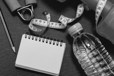 Lay Flat - Dumbbell, Measuring Tape, Hand Grip, Mineral Water, Fresh Apple, Pencil & Blank Notebook...