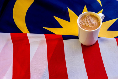 Malaysian Breakfast - Teh Tarik on Malaysia Flag. Teh Tarik is unofficially the national breakfast drink of Malaysia. It is a tea with milkの写真素材