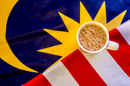 Malaysian Breakfast - Teh Tarik on Malaysia Flag. Teh Tarik is unofficially the national breakfast drink of Malaysia. It is a tea with milkの写真素材