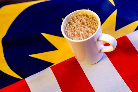 Malaysian Breakfast - Teh Tarik on Malaysia Flag. Teh Tarik is unofficially the national breakfast drink of Malaysia. It is a tea with milkの写真素材