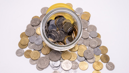 Jar of Malaysia coins on white background. Financial Concept.. Shallow Depth of fieldの写真素材