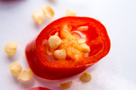 Macro - Red chilis. Close up, flare, selective focus, shallow depth of field.の写真素材
