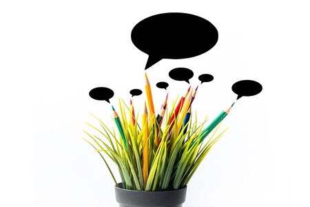 Nature Growth - Still Life Conceptual - Colored Pencils coming out of grass. Shallow depth of field,...