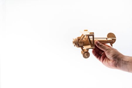 Hand Holding Model Aeroplane. Travel Concept. Isolate on white backgroundの写真素材