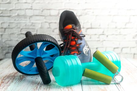 Fitness Equipment on Wooden Background. Shallow depth of field