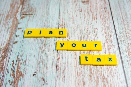 Plan Your Tax Concept - Word On Wooden Background. Shallow depth of field