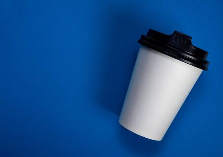 Take away coffee cup on blue backgroundの写真素材