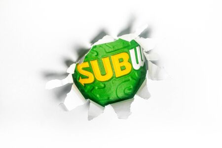 Kuala Lumpur, Circa 2020 - Subway logo piercing through a ripped white paper. Subway is an American...