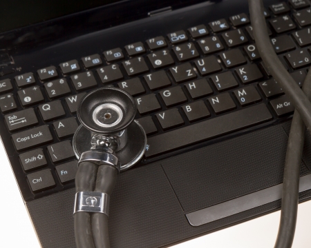 Stethoscope on computer netbookの写真素材