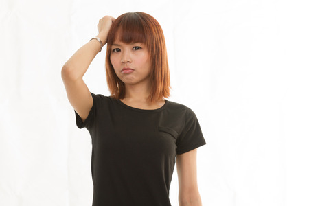 Upset disappointed female on isolated white の写真素材