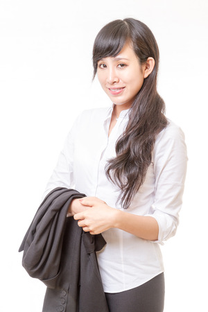 Chinese businesswoman with jacket draped over armの写真素材