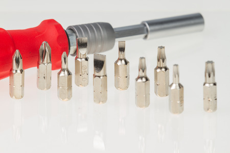 Screws, nuts, and bolts on isolated white backgroundの写真素材
