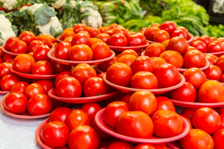 Ripe tomatoes at a traditional marketの写真素材