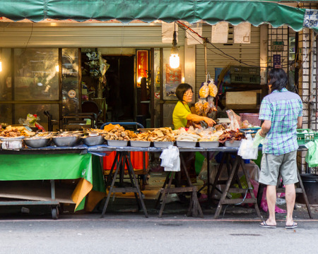 NEW TAIPEI CITY, TAIPEI, TAIWAN. NOVEMBER 2, 2014. Traditional street market in Taiwan with vendors selling fruit and vegetablesのeditorial素材