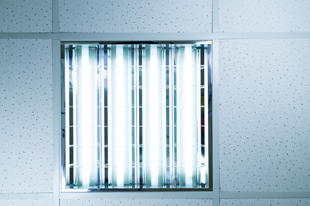 Fluorescent ceiling lights in an officeの写真素材