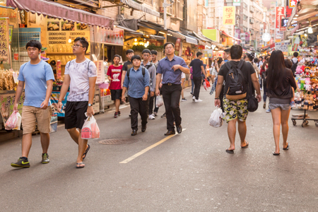 NEW TAIPEI CITY, TAIWAN - SEPTEMBER 11, 2015: Shoppers and vendors in Danshui Pedestrian shopping areaのeditorial素材
