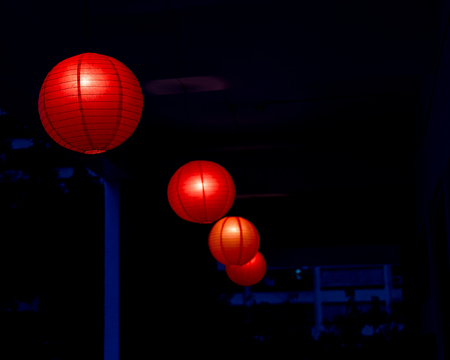 Row of red Chinese lanterns hangingの写真素材