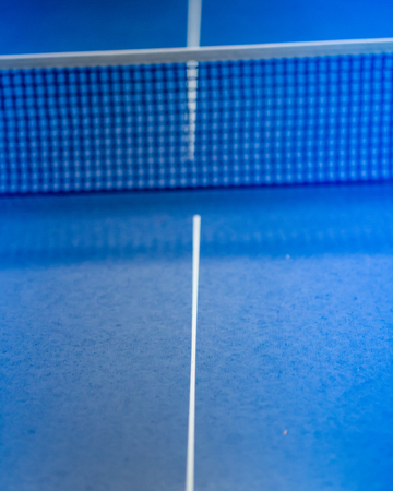 Net on blue ping pong tennis tableの写真素材