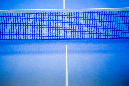 Net on blue tennis tableの写真素材