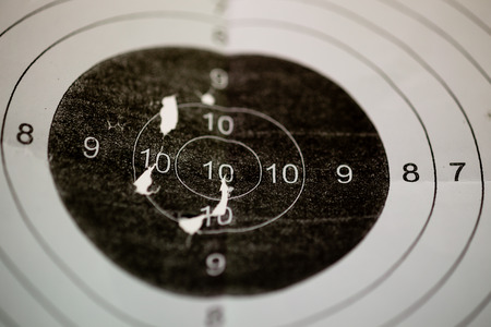 Bullet holes in shooting range targetの写真素材