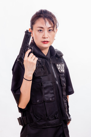 Chinese female police officer with handgunの写真素材