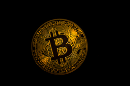 Macro shot of Bitcoin crypto currency on black backgroundの写真素材