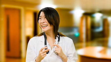 Chinese female doctor in hospital laughingの写真素材