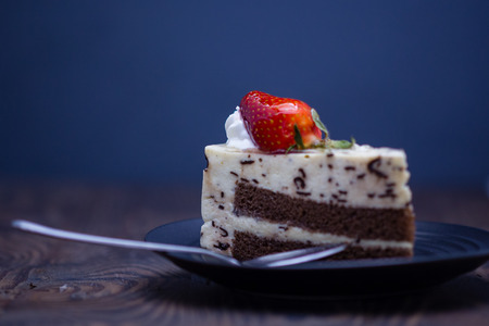 Chocolate and cheese cake on distressed wood backgroundの写真素材